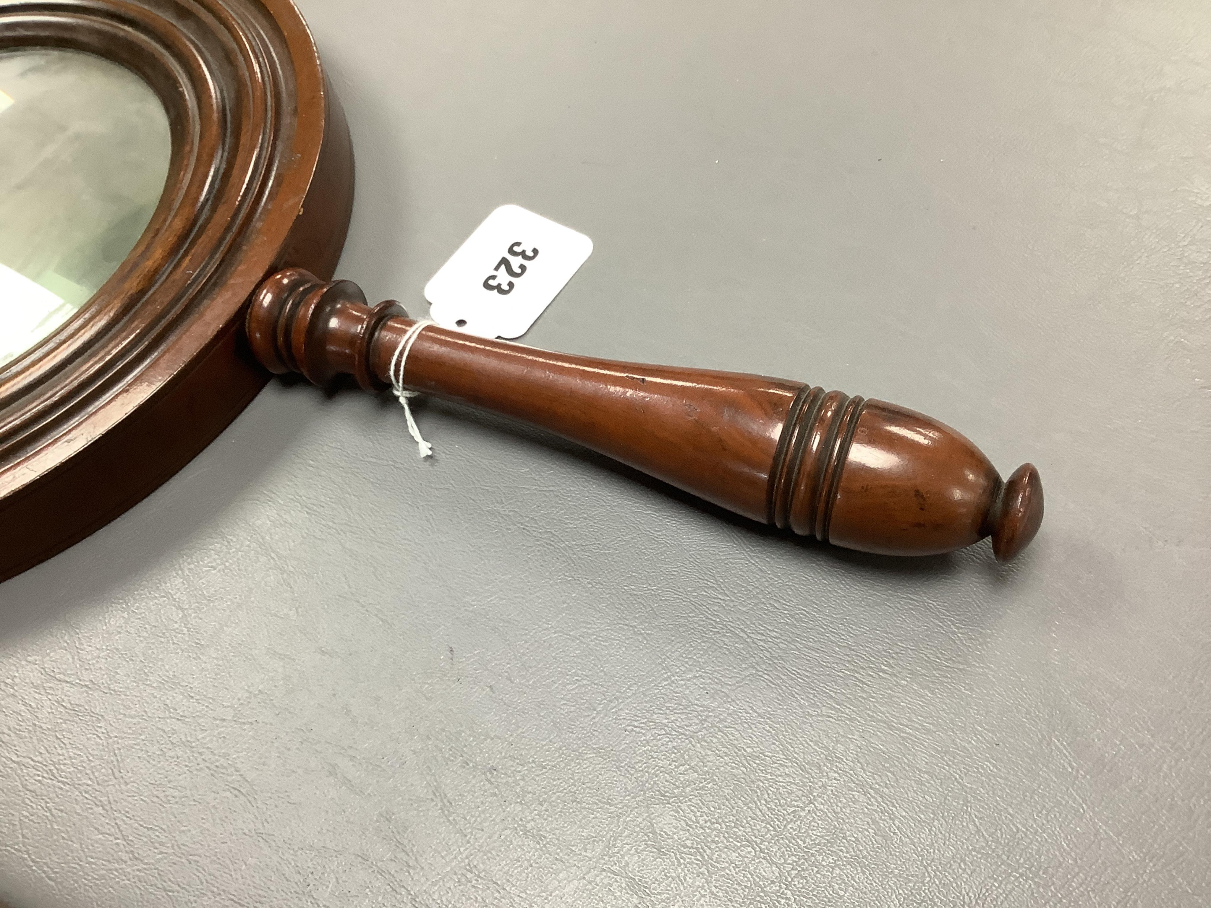 A large oversized 19th century fruitwood magnifying glass, 50cm in length